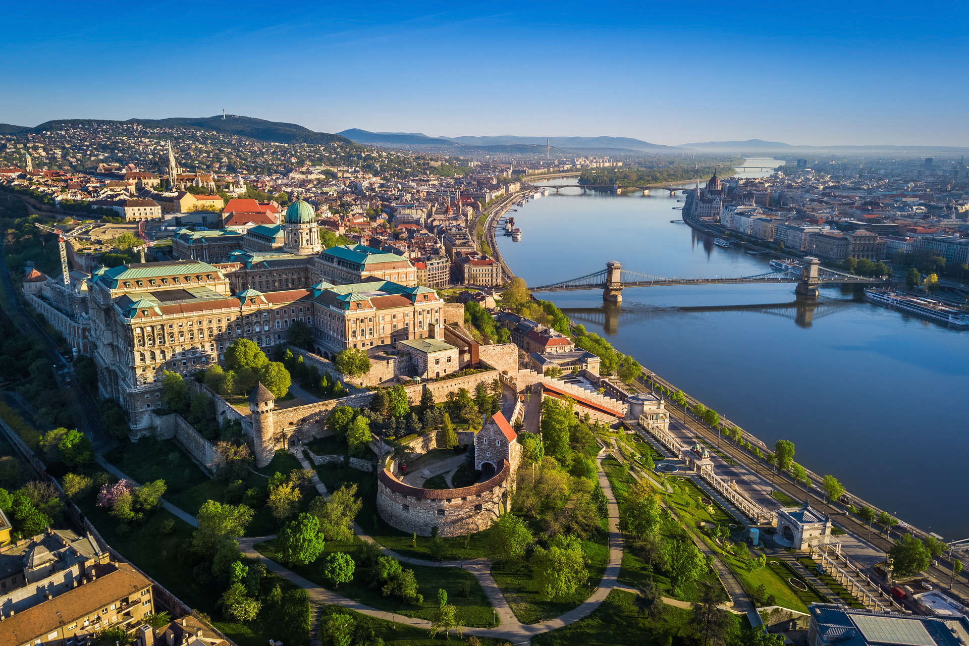 aerial skyline view of Budapest at sunrise with Szechenyi Chain Bridge