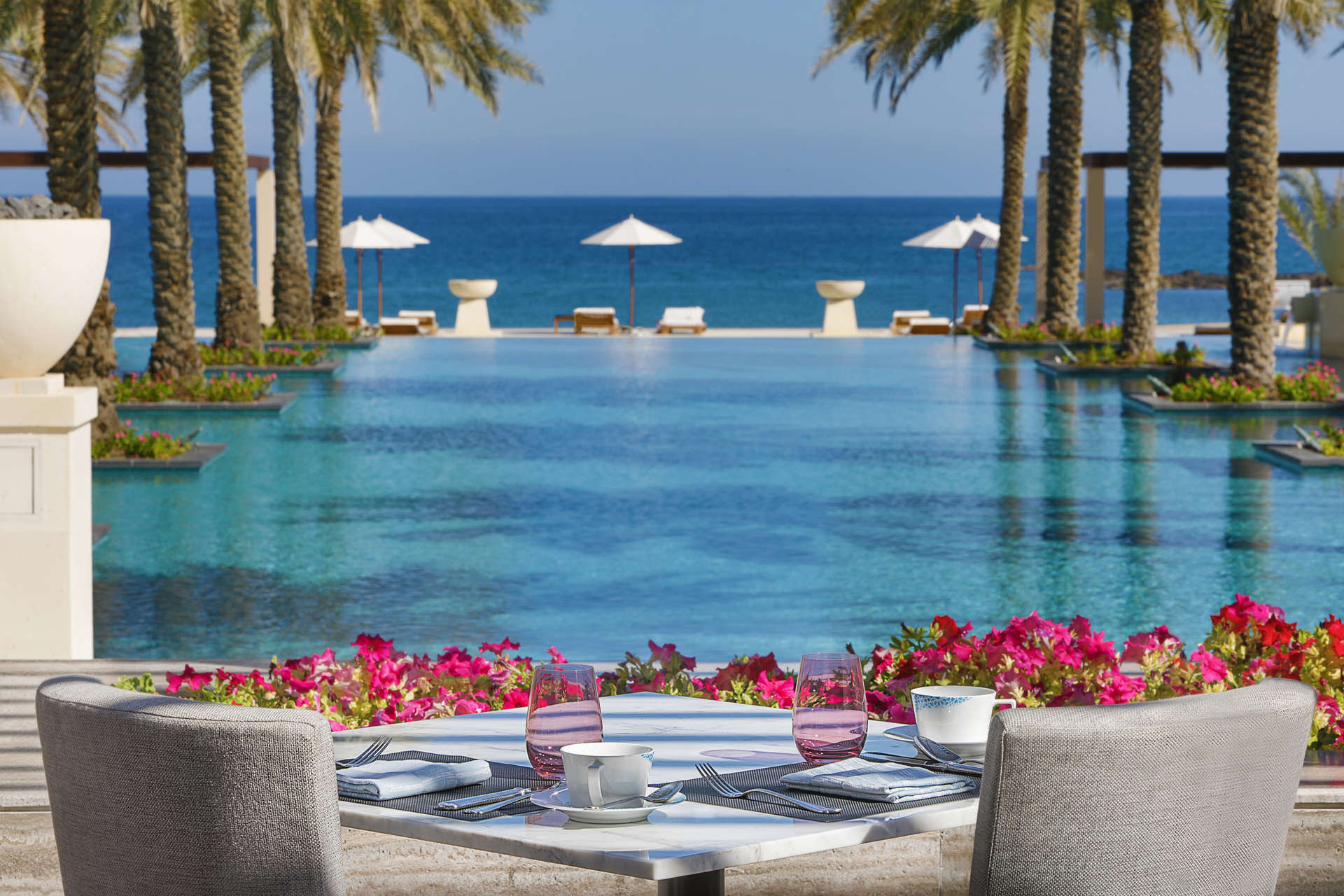 Al Bustan Palace, a Ritz-Carlton Hotel Al Khiran Kitchen - Pool View Terrace.jpeg