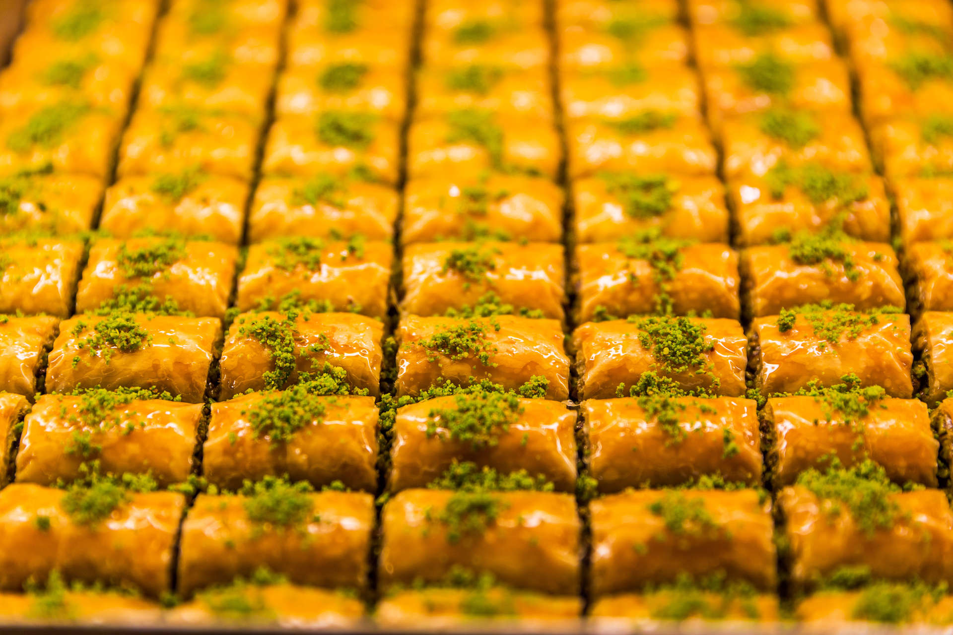 Baklava are buttery layers of filo pastry and crushed nuts drizzled in syrupy honey