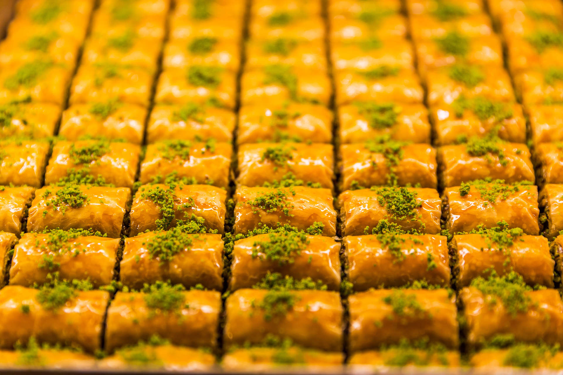 Baklava are buttery layers of filo pastry and crushed nuts drizzled in syrupy honey