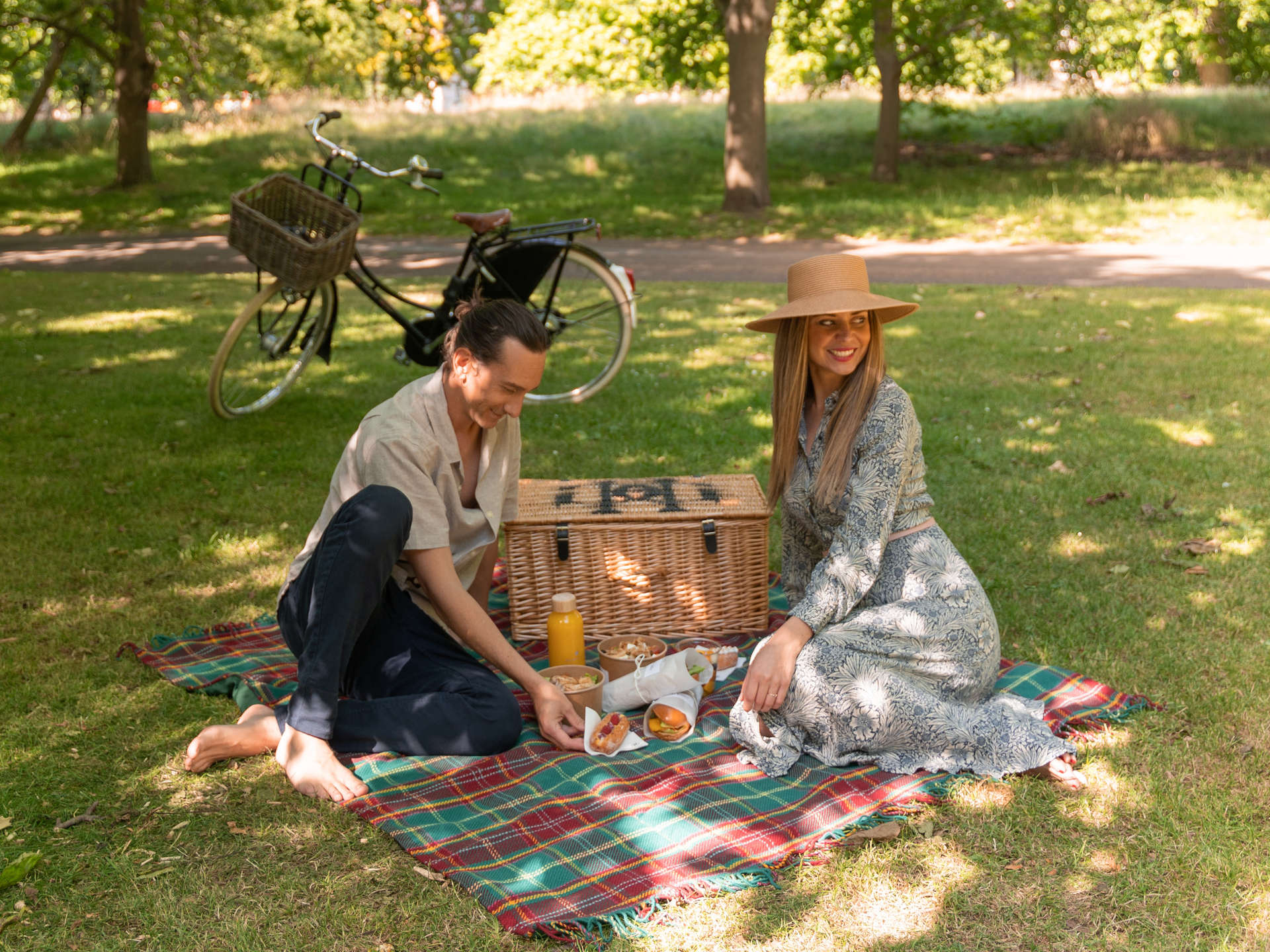 Couple enjoying picnic at Hyde Park, London