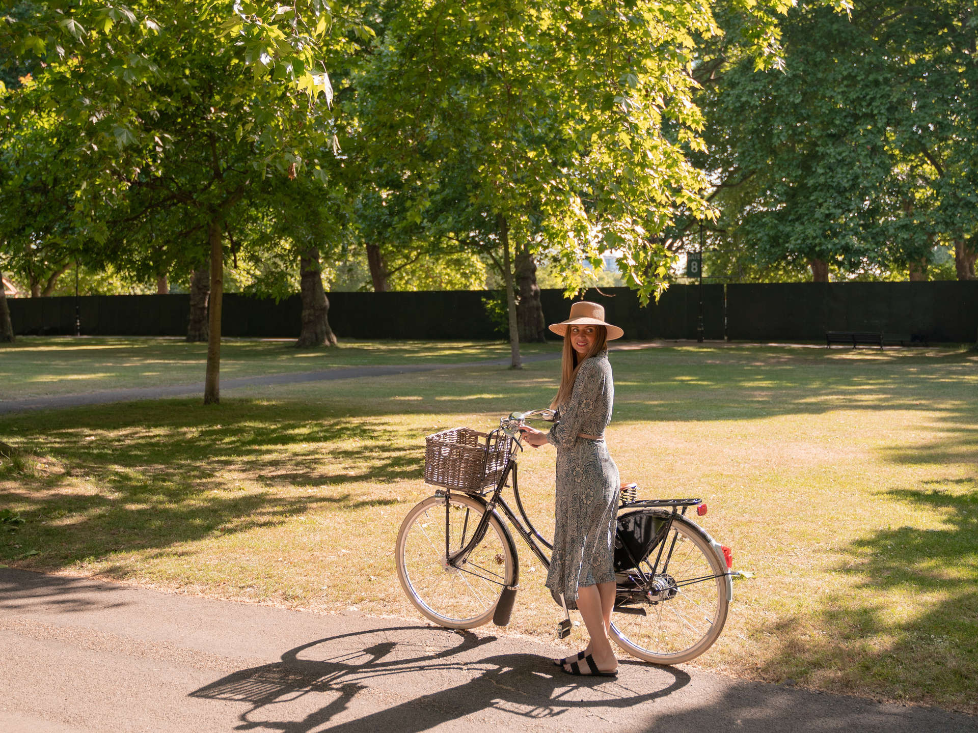 Cycling on broad walk in Hyde Park, London