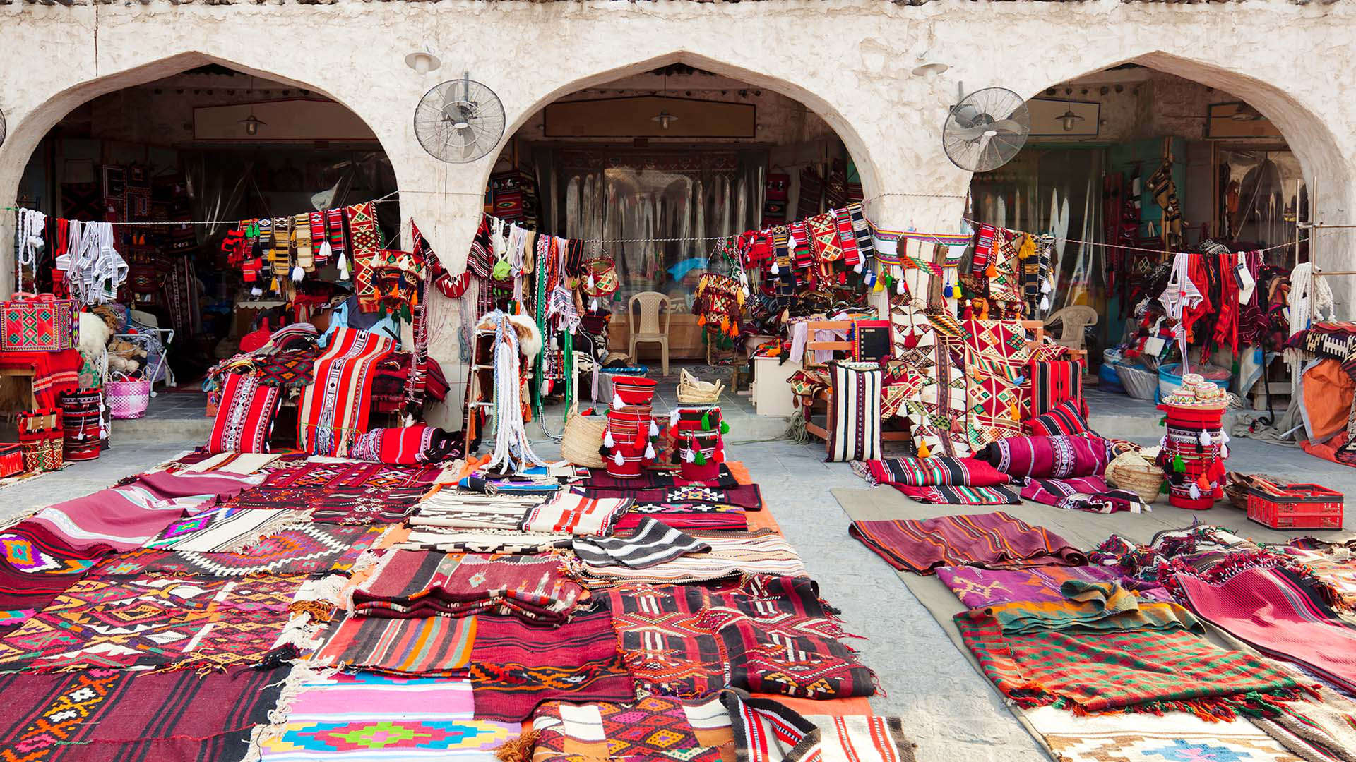 textile shop along the street in the Souq Waqif area in Doha, Qatar