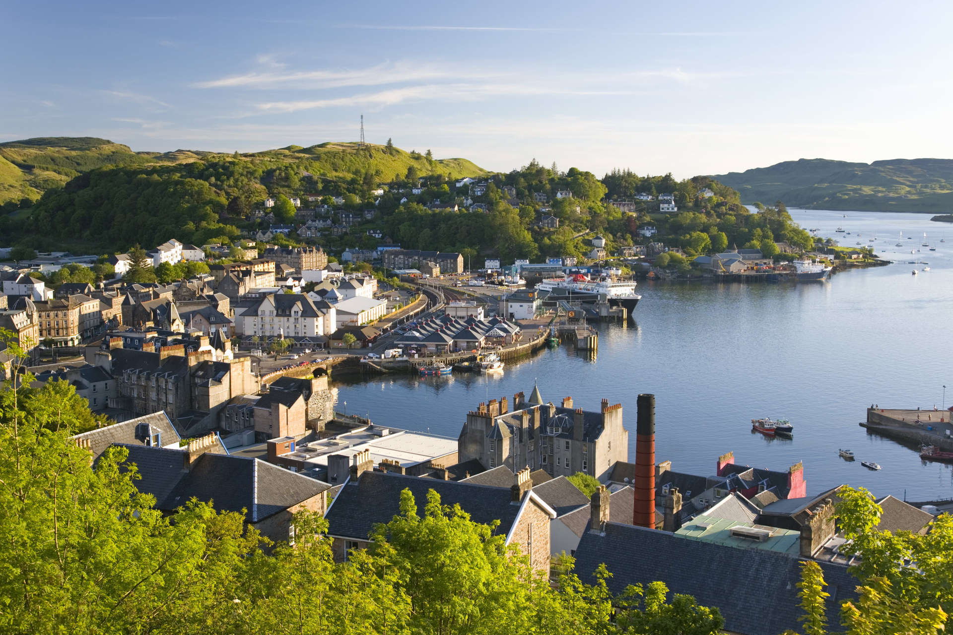 View over the harbour from McCaig's Tower, distillery chimney prominent, Oban, Argyll and Bute, Scotland, United Kingdom